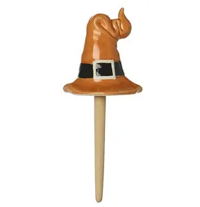 ORANGE CERAMIC HAT ON WOODEN STAKE